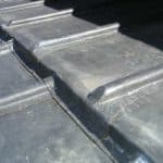 Roof flashing installation for weatherproofing and durability.