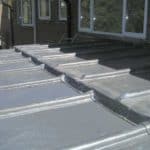 Roof waterproofing with metal sheets for residential buildings.
