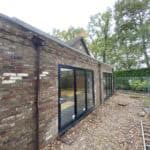 Extension to rear of house with modern glass doors, enhancing space and natural light.