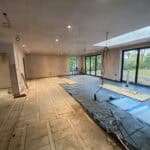 Rear extension construction in Wrecclesham with open-plan design and large glass doors.