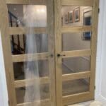 Double glazed wooden doors with glass panels for rear extension.