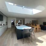Bright open-plan kitchen and living space with skylight in Wrecclesham extension project.