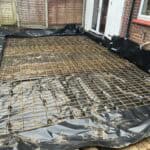 Reinforced concrete base with steel mesh for single storey rear extension in Tongham.