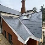 Extended rear extension featuring durable slate roofing, enhancing the property's aesthetic and func.