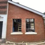 Extension construction with new windows in Winchfield.