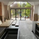 Spacious single storey rear extension in Winchfield with large glass doors and modern interior.