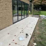 Modern glass extension installation for enhanced outdoor living.