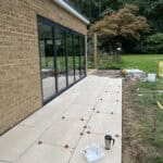 Extension and refurbishment of a property in Normandy, showcasing new patio installation.