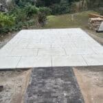 Modern porcelain patio with clean lines in Wrecclesham, perfect for outdoor living spaces.