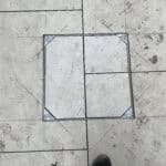 Porcelain patio with metal frame in Wrecclesham, showcasing high-quality outdoor paving.