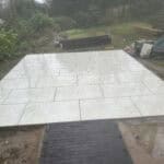 Porcelain patio with sleek, durable tiles installed in Wrecclesham by ConstrucTek. Perfect for outdo.