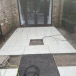 Porcelain patio with new tiles installed outside a residential property in Wrecclesham.