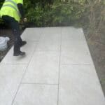 Porcelain patio being installed outdoors in Wrecclesham, showcasing durable and stylish paving solut.