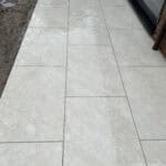 Modern porcelain patio paving slabs outside a property in Wrecclesham, Surrey.