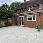 Rear extension with modern glass doors and windows in Tongham.