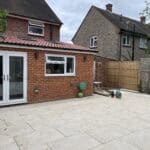 Modern rear extension with patio area in Tongham.
