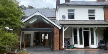 Rear extension with modern glass features for improved living space in Winchfield.
