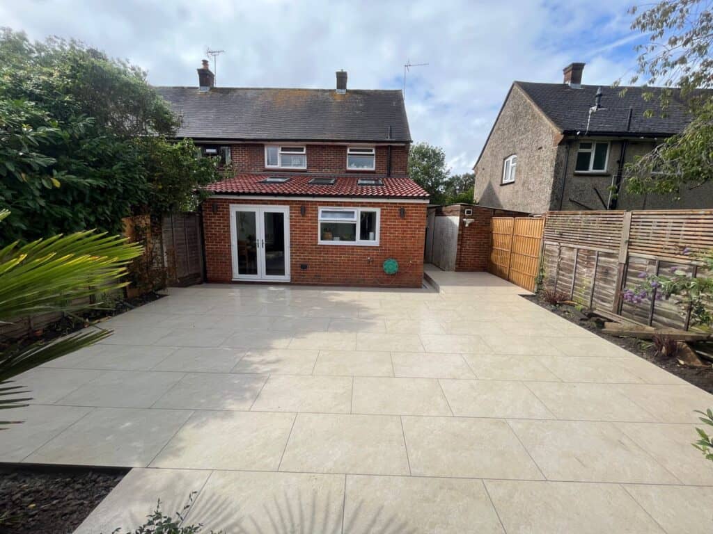 Single storey rear extension in Tongham with French doors and a new porcelain patio