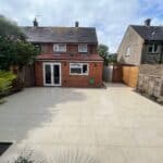 Rear garden with new patio and extension in Tongham.