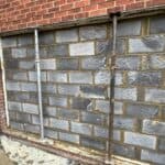Blockwork infill to the old garage opening