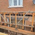 Wraparound extension and kitchen refit in Aldershot – back wall needled and propped before it came out