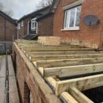 Wraparound extension and kitchen refit in Aldershot – flat roof joists going on