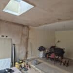 Wraparound extension and kitchen refit in Aldershot – inside plastered, with the rooflight in