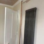 Wraparound extension and kitchen refit in Aldershot – new radiator and door in the extension