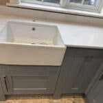 Wraparound extension and kitchen refit in Aldershot – refitted kitchen with belfast sink