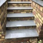 New brick steps up to the garden
