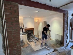Load-bearing wall removed with a new steel beam on brick piers