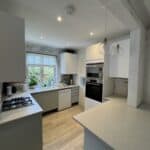 Finished open-plan kitchen and dining room with new flooring