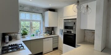 Finished open-plan kitchen and dining room with new flooring