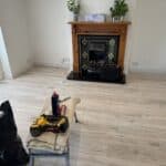 Lounge with new flooring and skirting, opened up to the kitchen