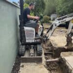 Wraparound extension and garage conversion in Farnham – digging out footings for the wraparound extension