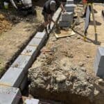 Wraparound extension and garage conversion in Farnham – footings poured and blockwork coming out of the ground