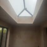 Wraparound extension and garage conversion in Farnham – roof lantern from inside, plastered
