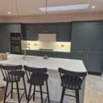 Wraparound extension and garage conversion in Farnham – kitchen island with breakfast bar seating