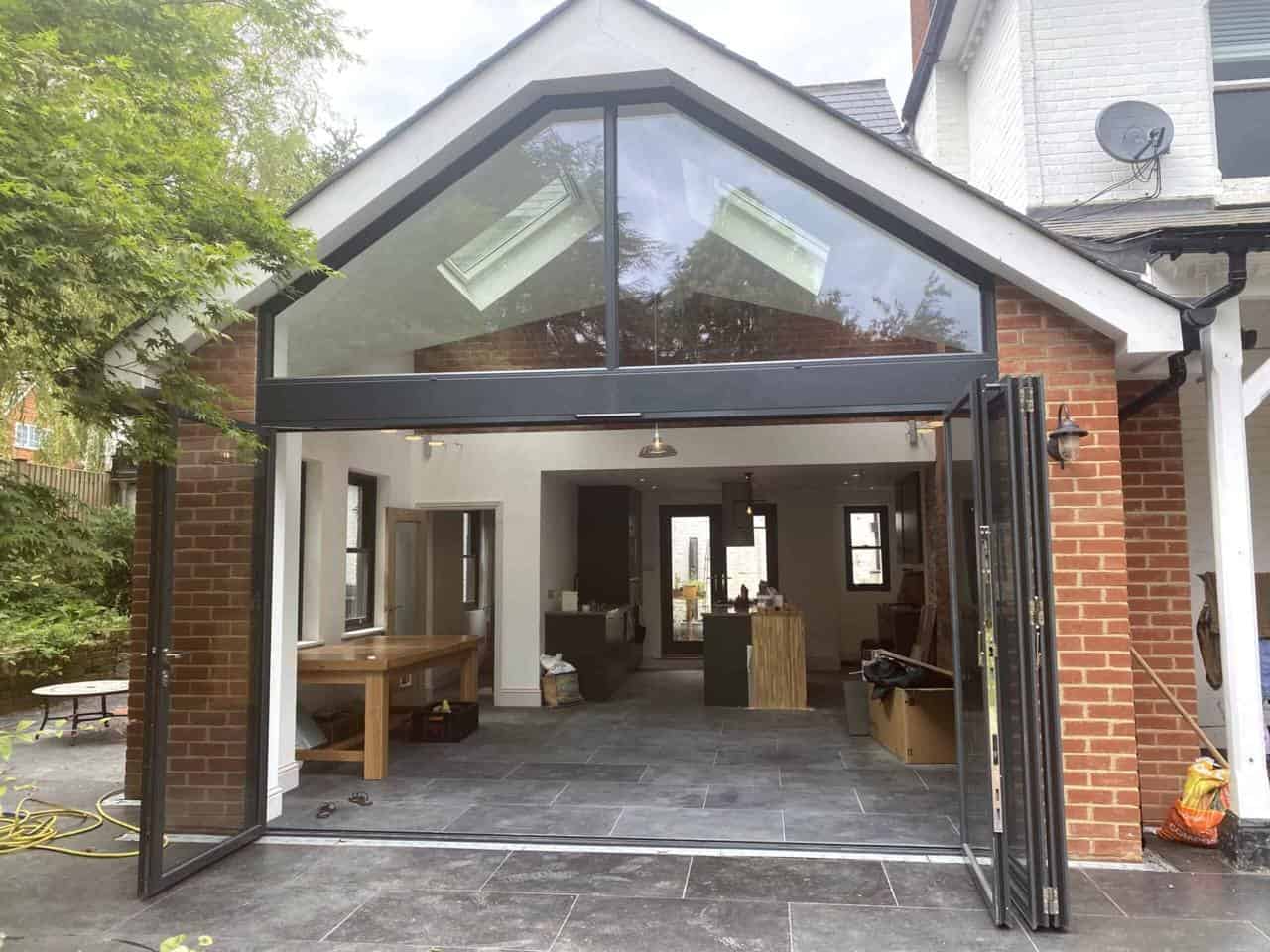 Glass gable extension with bifold doors open, Winchfield