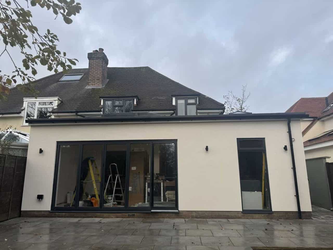 Finished wraparound extension with large glazed doors, Farnham