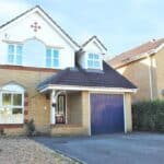Garage conversion in Tongham – before: the front of the house with the garage door