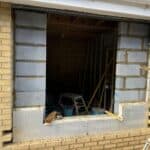 Garage conversion in Tongham – garage door out and the new opening formed