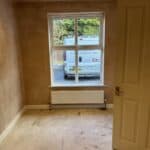 Garage conversion in Tongham – room plastered, new window in