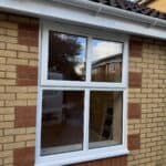 Garage conversion in Tongham – new window with brick quoins matched to the house