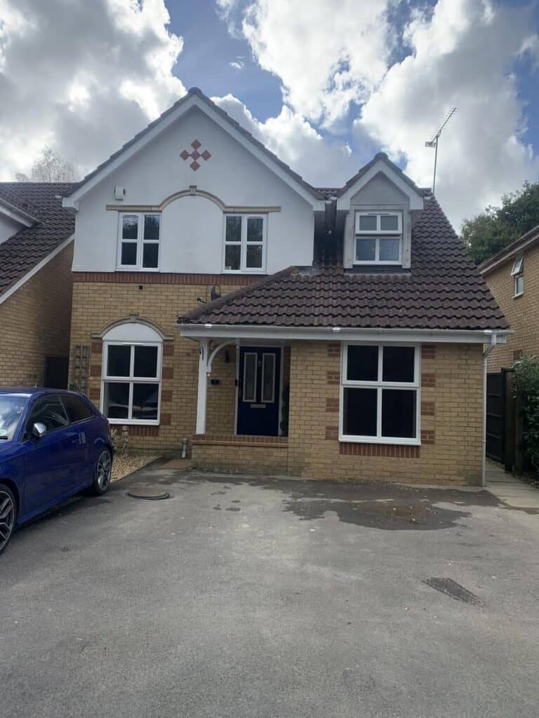Finished garage conversion in Tongham with a new front window