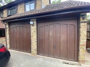 Double garage with wooden doors before conversion
